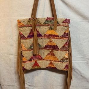 Made in India. Beautiful purse with leather fringe. Love stitch brand. No tag.